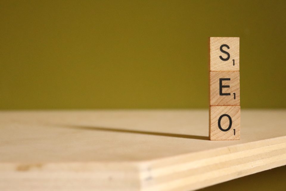 3 stacked scrabble tiles spelling out SEO